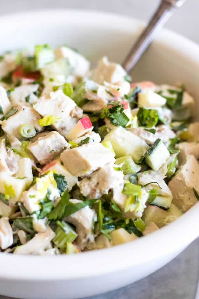 white bowl of whole30 Chicken Salad on a gray background