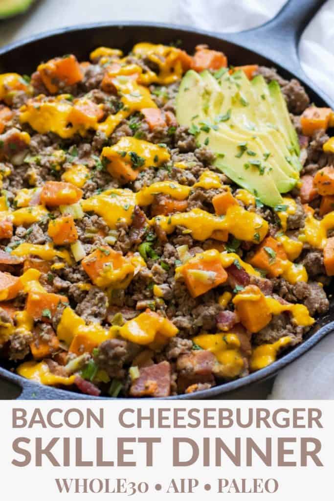 a skillet of ground beef, bacon, dairy free cheese sauce, and avocado sprinkled with cilantro,