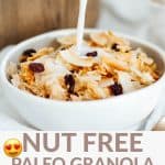 A white bowl of Paleo Granola with cinnamon and raisins with milk being poured on top.
